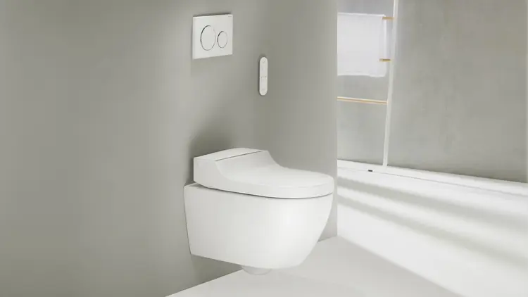 WC japonais blanc avec sa télécommande